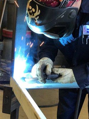 One of our welders working on a project, ignoring the sparks flying at him