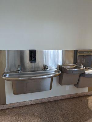 No running water in the restroom. You have to wash up at the Communal Sink between the restrooms.