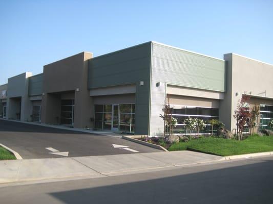 Pre-engineered metal structure with steel and stucco siding