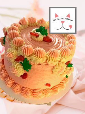 Strawberry cake filled with strawberry cream and topped with a whipped strawberry buttercream! thefatcatcookiejar.com