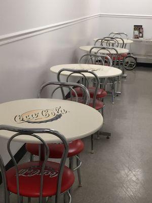 Cute 50's looking soda shop tables & chairs. They also have outdoor seating.