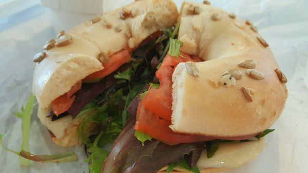 Farmer's Salty Dog: Exquisite, French dijon mustard & melted Swiss topped w/spring greens, juicy tomato on a sunflower seasalt bagel.