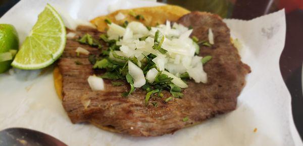 This is my up charge skirt steak taco, that's not skirt steak