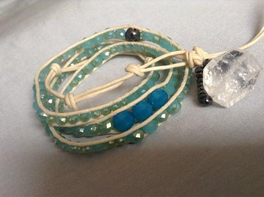 Glass beads, Swarovski crystals, hematite, and a quartz closure.  Chan Luu style.