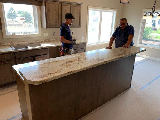 The Great Lakes Countertops & Kitchens team working on an installation project.