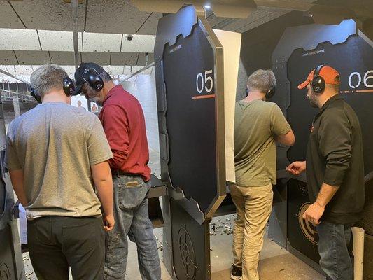 My husband & FIL helping them load the guns & shoot them