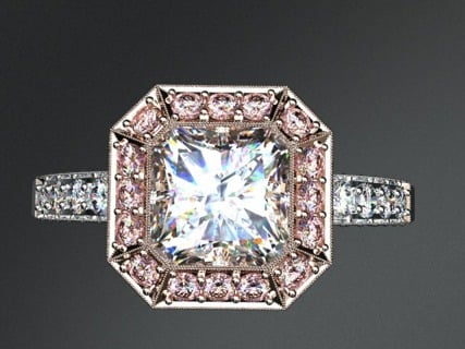 Engage,ent ring with halo of natural fancy pink diamonds.