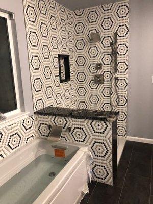 Bathroom remodel including tile instillation and finishes