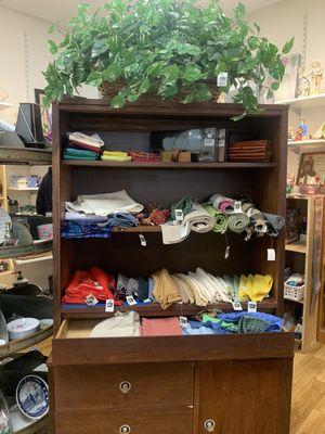 Shelves full of assorted linens.