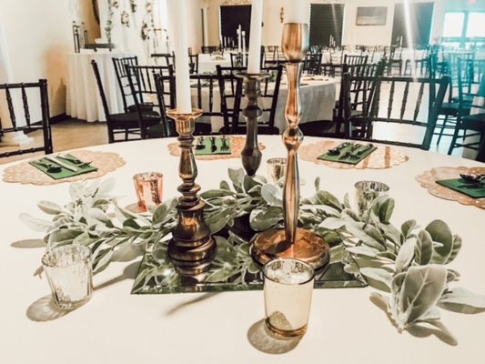 Ivory and Greenery table centerpieces