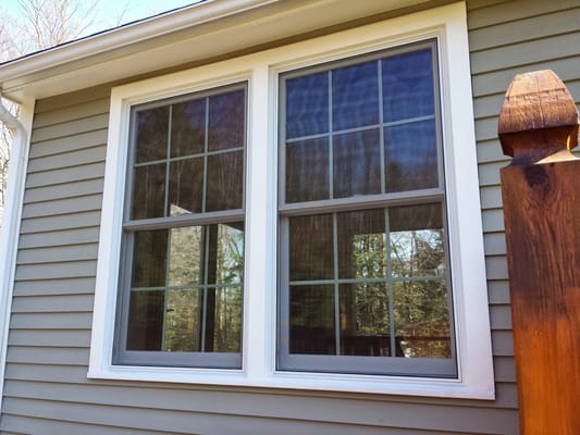 double hung windows that are mulled with grilles between the glass