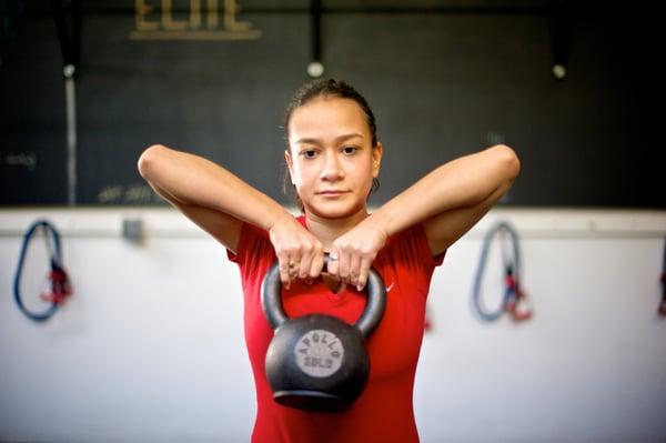 Sabrina performing Kettlebell squat pulls.