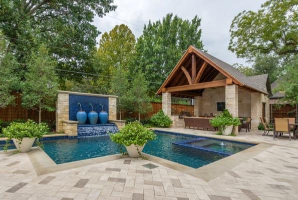 pool cabana with urn planters