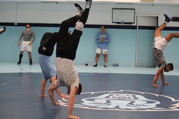 Columbia Wrestling performing bodyweight exercises; a staple of Ancient 8 Labs' programs.