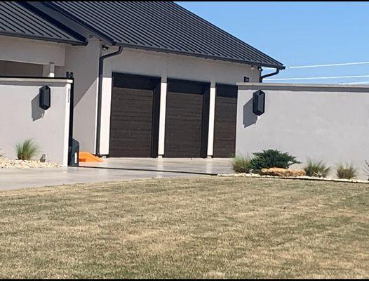 Stained garage doors and painted fascia