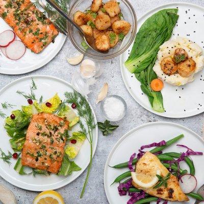 Plated Salmon, scallops, and halibut