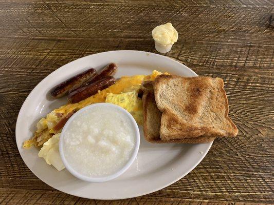 3 egg ham, cheese, and onion omelet. 3 links of breakfast sausage. Grits. 2 slices of wheat toast.