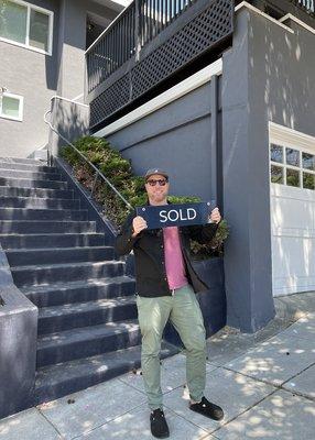 happy buyer taking keys to his new house thanks to azar!