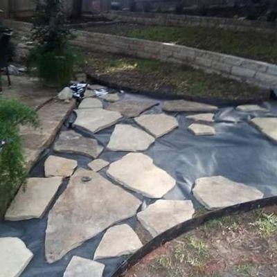 Before image laying flagstone with River rocks in between you will see it's going to come out nice check out the next picture