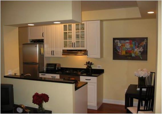 Renovated kitchen in condo, new cabinets, granite countertops, new wood floors, recessed lighting