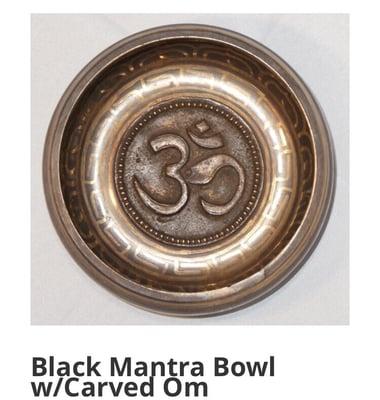 Black mantra bowl with Om carving.