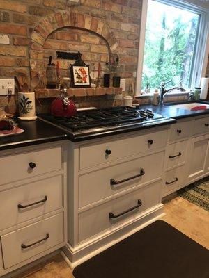 Drawers for pots under the stove. Upper drawers right and left for cooking tools and flatware.