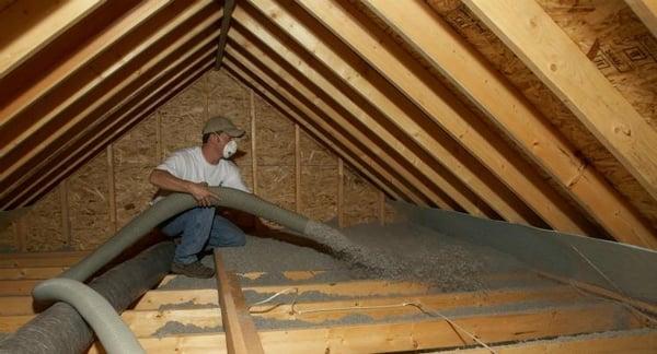 Improving residential comfort and energy efficiency by installing cellulose attic insulation.