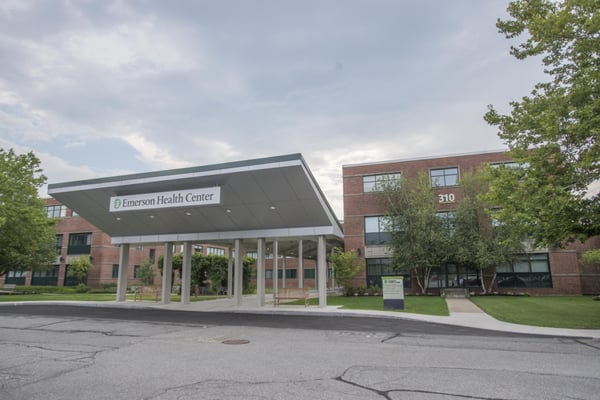 The Cantu Concussion Center entrance is located down the walkway beneath the Emerson Health Center sign, left of the building marked 310.