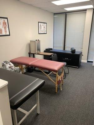 Treatment area with heat pads, cold packs, electric stim and ultrasound and intersegmental traction table