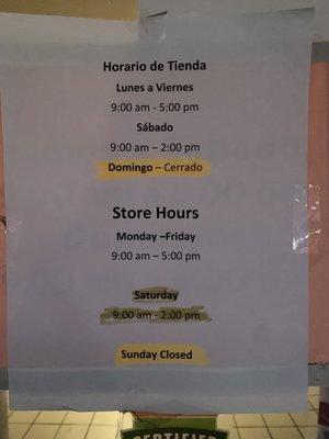 Store hours listed on entry door.