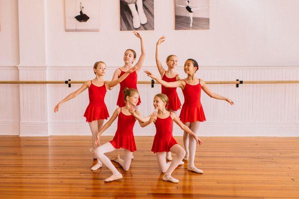 Dancers pose in the MAB studios