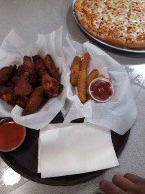 Wings, mozzarella sticks and pizza.