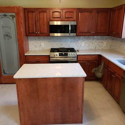 New countertops, flooring, backsplash and custom built pantry cabinet