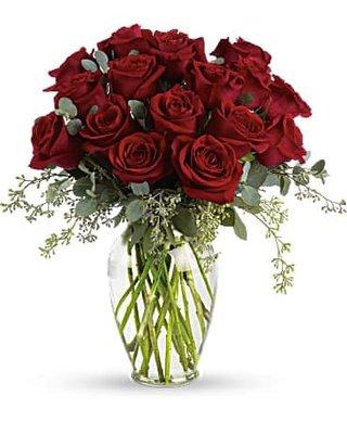 ONE DOZEN LONG STEM RED ROSES ARRANGED IN A VASE