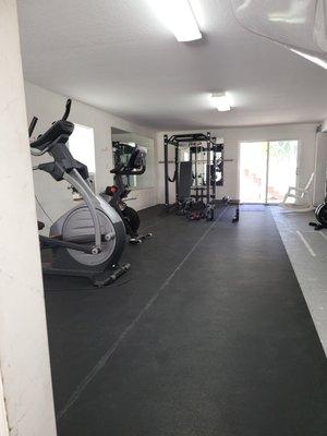 Amazing gym. Port Richie Area glue down, rolled out rubberflooring..