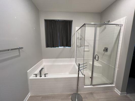 Before: builder installed tub and shower.