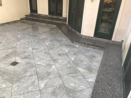 Custom Granite Steps and Porcelain Tile Patio