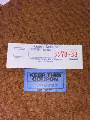 The guest receipt for my food and the coupon for the free fried fish and grits