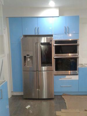 Cabinets and wood floor installed