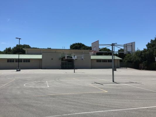 Gym and blacktop with basketball courts