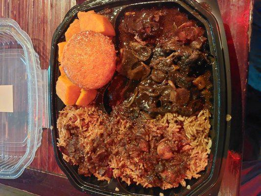 Oxtails, peas and rice, candied yams, and a muffin to top it off.