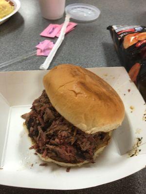 Chopped beef sandwich, a lot of meat and you add your own BBQ sauce