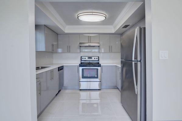 One of our beautifully remodeled kitchens with quartz counter tops!