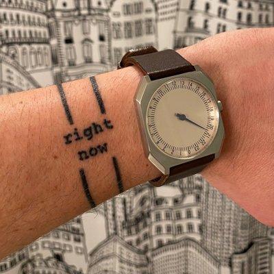 Thin bands with small text on wrist