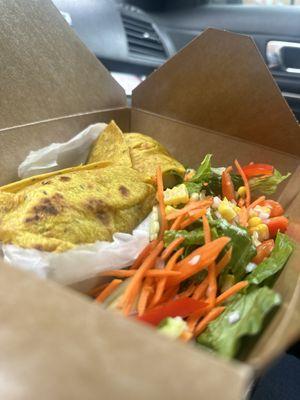 Our tasty tumeric whole wheat shrimp wrap with a side of our tropical salad.