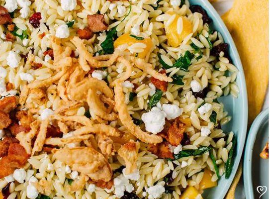 A wonderful addition to a potluck or banquet, this salad mixes bacon and spinach with the sweetness of juicy peaches and dried cranberries.