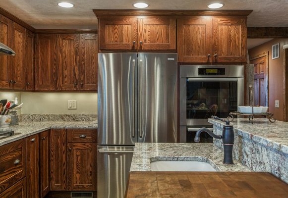 Steel and wood create visual interest in a remodeled kitchen.