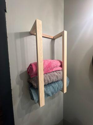 A custom Cherry wood towel rack