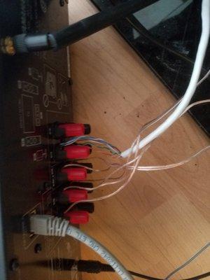 Used cat-5 network cable for both surround speakers wired to one channel at the receiver.