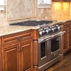 Custom granite tile and travertine subway backsplash